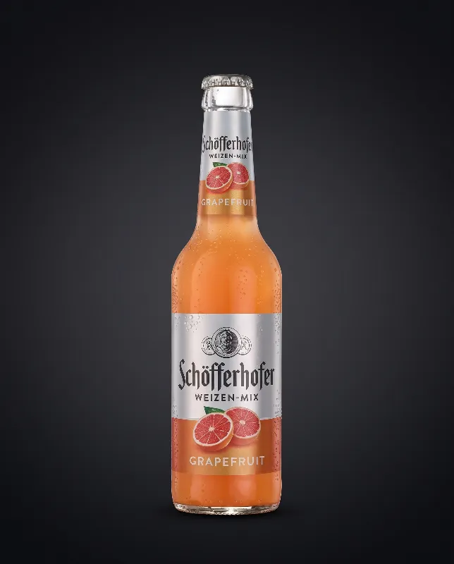 Flasche Schöfferhofer Grapefruit mit silberner Kappe und orange-rosa Etikett
